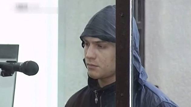 Sériový vrah a kanibal Alexandr Vladimirovič Byčkov u Krajského soudu Penzenské oblasti v den vynesení rozsudku, 22. března 2013