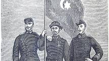Tři rumunští vojáci s ukořistěnou osmanskou vlajkou. Z obálky rumunských válečných novin Resboiul