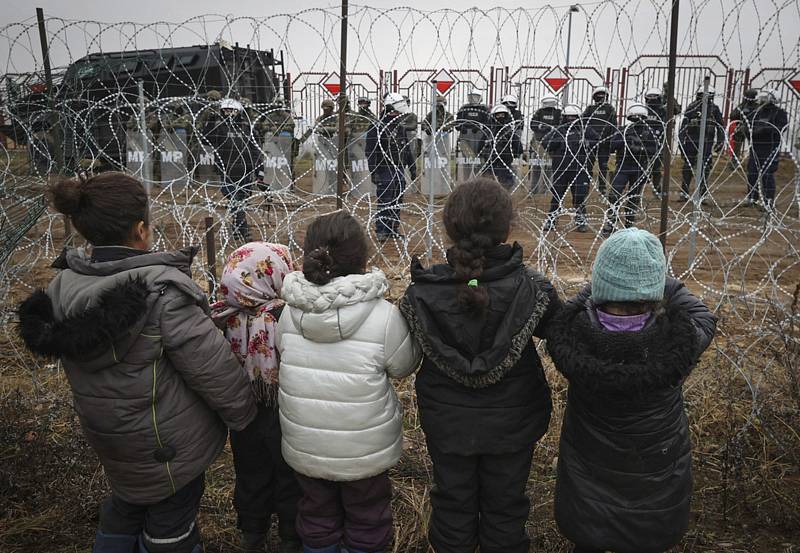 Uprchlíci na bělorusko-polské hranici u města Grodno, 17. listopadu 2021