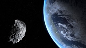 Ilustrace asteroid, který prolétává kolem Země.