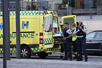 Záchranáři a policisté zasahují na místě střelby v dánské Kodani, 3. července 2022.