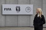 A woman stands in front of the headquarters of the Football Association of the Czech Republic (FAČR) in Strahov, Prague, on October 16, 2020.