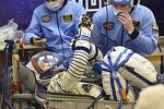 Astronaut Norišige Kanai v sedadle stroje Sojuz