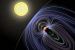 Umělecké ztvárnění exoplanety Tau Boötes b. Znázorněné čáry představují neviditelné magnetické pole chránící tuto planetu před slunečním větrem