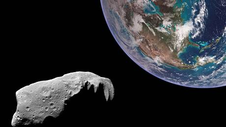 Asteroid letící kolem Země. Ilustrační foto.
