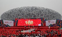 BEIJING, CHINA - APRIL 18:  Chinese people celebrate during a Coca-Cola ceremony to mark 100-day countdown to London 2012 Olympic Games at National Stadium, also known as the Bird\'s Nest, on April 18