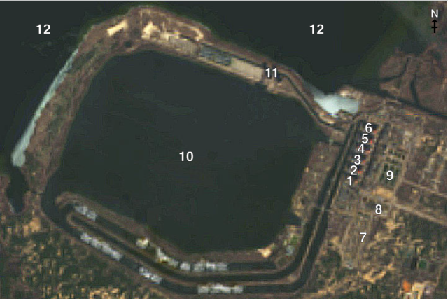 Komentovaná fotografie Záporožské jaderné elektrárny 1-6 z družice Landsat 9 z 27. února 2022. Reaktorové bloky 1-6 7. Elektrické stožáry 8. Opláštěná výcviková budova 9. Sklad radioaktivního odpadu 10. Chladicí jezírko 11. Chladicí věže 12. Nádrž