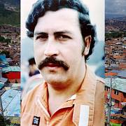 Pablo Escobar, na pozadí město Medellín