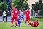 Holýšov footballers (in the archive picture of players in red jerseys) recorded a match in Staňkov, where they lost 0: 2, but in the end they celebrate all three bodies.