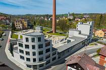 Stavba - přestavba bývalé textilní továrny v Plesné.