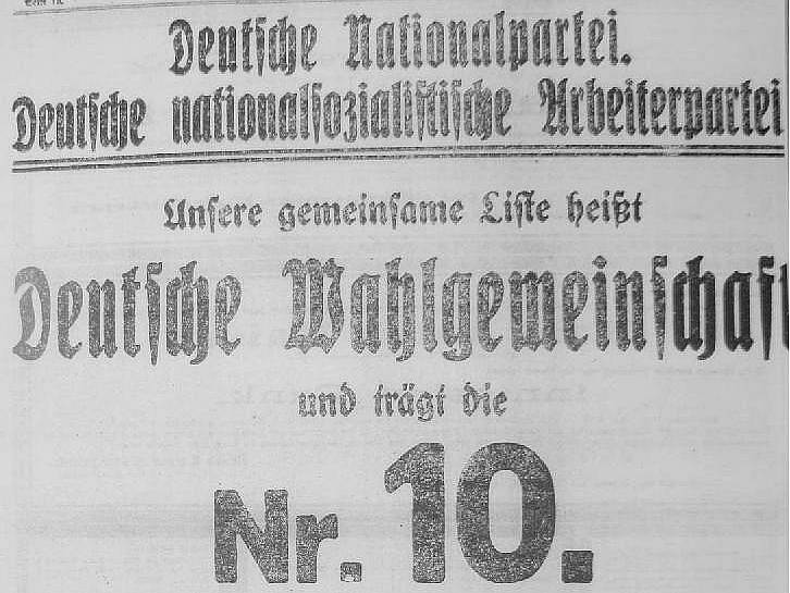 REKLAMA Z POČÁTKU STOLETÍ. Tato volební upoutávka láká voliče k urně Německé národní strany a Německé nacionálně–socialistické dělnické strany (NDSAP), zde sdružené do „Deutsche Wahlgemeinschaft“ (Německé volební souručenství). 