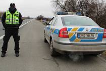 Policejní kontrola u sjezdu na dálnici u Horní Moštěnice, 1. března 2021