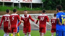 Fotbalisté SK Petřín Plzeň B (červení) vstoupí do nové sezony krajského přeboru jako nováček, ale zároveň budou patřit k největším favoritům.