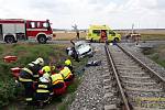 Srážka motorového vlaku a osobního auta u Kamenného Újezdu, 18. 7. 2019.