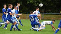 Divizní fotbalisté Slavičína (v modrém) ve 3: kole skupiny E doma přetlačili favorita z Přerova a porazili jej s novým trenérem na lavičce 1:0.