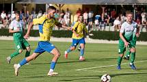 Fotbalisté Kozlovic (ve žlutém) doma porazili Bzenec 2:0. Adam Galetka