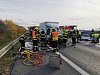 D1 u Prahy zablokovala nehoda náklaďáků, jeden řidič zůstal zaklíněný ve vozu