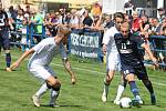 V úvodním kole nového ročníku MSFL porazil nováček FK Blansko (modré dresy) v regionálním derby tým MFK Vyškov 3:1.