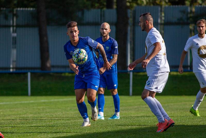 Dětmarovice (v bílém) zdolaly ve šlágru kola Rýmařov. Foto: Tadeáš Bednarz