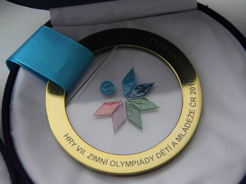 Kulatá skleněná medaile s emblémem ODM. 